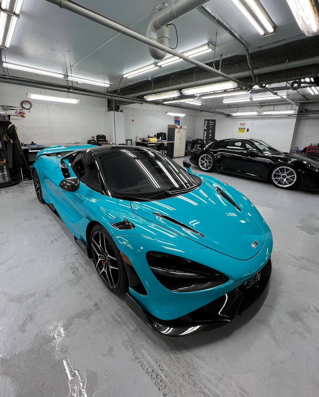 Blue McLaren 720S in a detailing shop