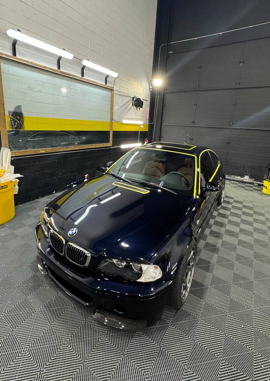 Dark blue BMW E46 undergoing detailing preparation
