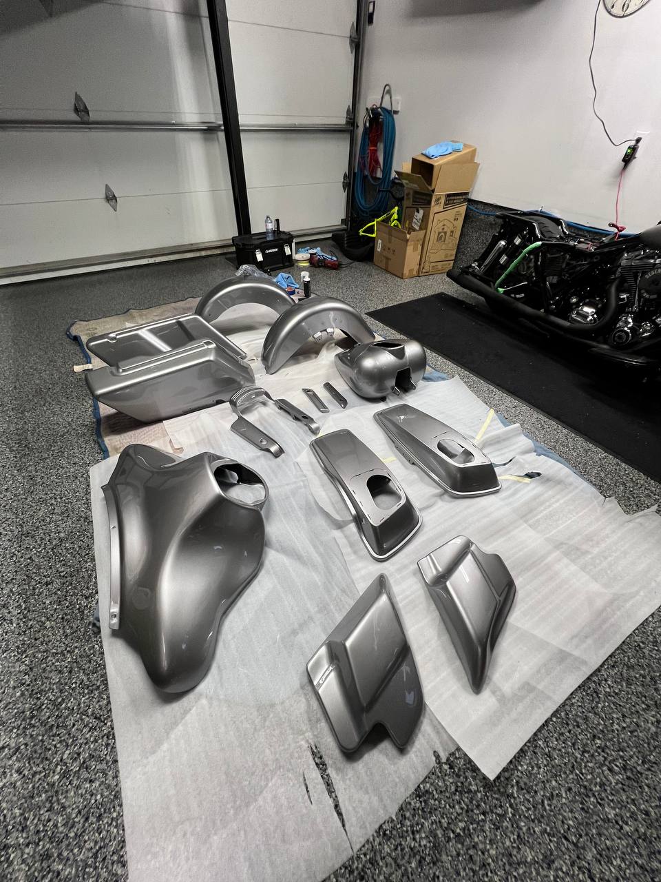 Motorcycle parts laid out for ceramic coating preparation