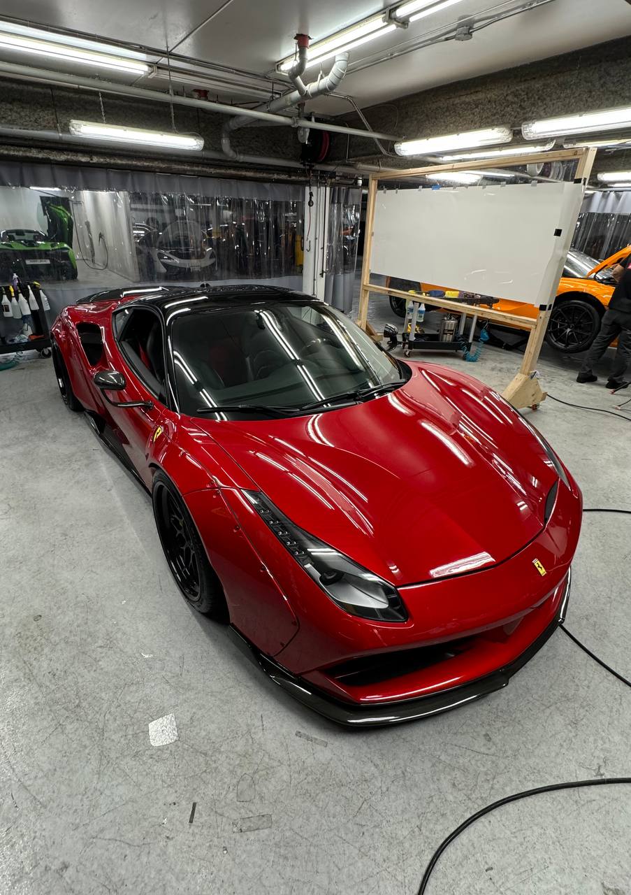 Red Ferrari 488 in detailing shop